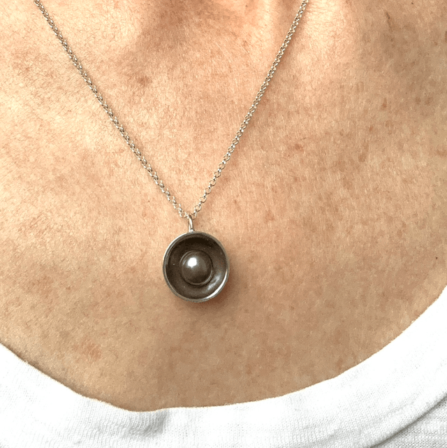 Peacock Pearl in a Silver Dome 