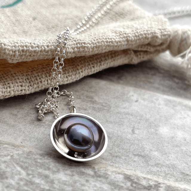 Peacock Pearl in a Silver Dome 
