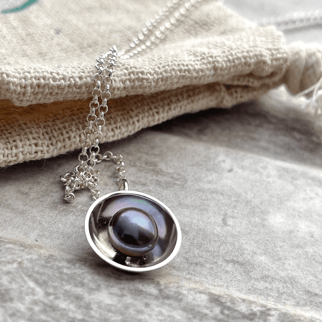 Peacock Pearl in a Silver Dome 